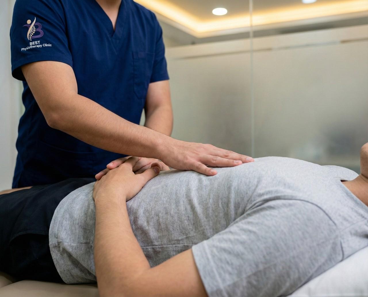 Physiotherapist performing chest physiotherapy technique to support deep breathing and airway clearance.