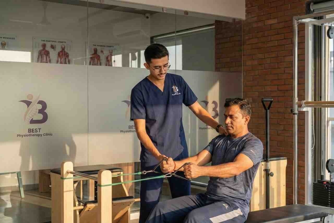 Physiotherapist Dr. Kanaiya assisting patient with resistance exercise for strength rehabilitation